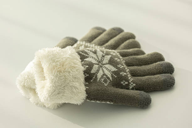 istock Pair of grey knitted gloves 2186818181