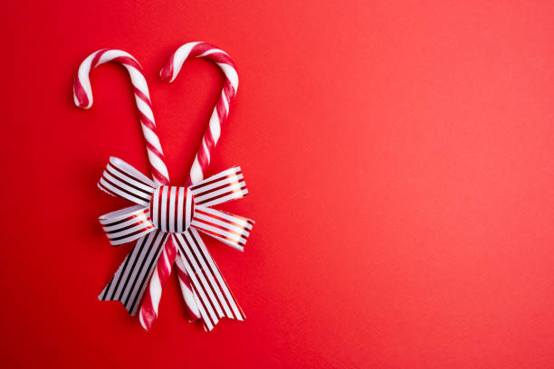 Christmas background with candy canes. Poster, banner, greeting card template. Festive backdrop. Holiday season. Xmas frame