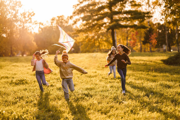 istock Carefree children whit kite playing in nature 2186819207