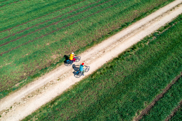 istock Two cyclists on a dirt road, aerial view 2186820649