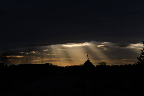 dramatic sunset with clouds and rays of the sun.