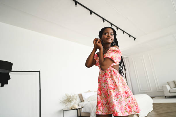 istock Young woman in front of mirror. 2186821078