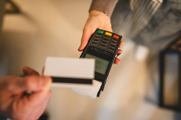 istock Credit card payment machine in use during a business transaction 2186821104