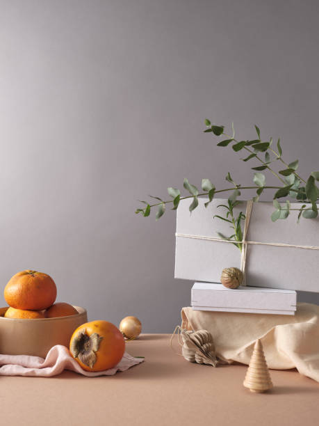 istock Creative still life with holiday decorations and gifts. Neutral background, copy space 2186821525