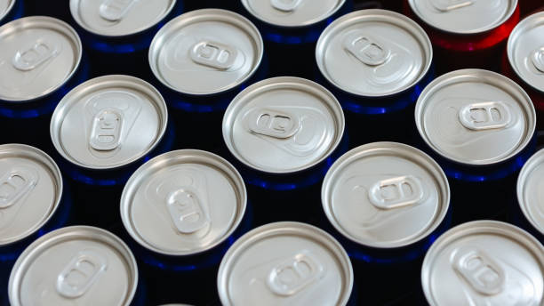 istock Overhead view of neatly arranged red and blue beverage cans with silver tops 2186823896