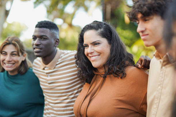 istock Multi generational diverse people having fun hugging each other outdoor - Multiracial community concept 2186824595