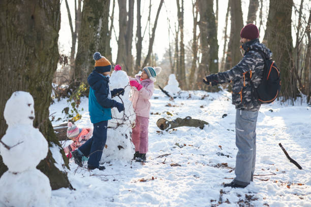 istock Beautiful family having fun on a winter day 2186829584