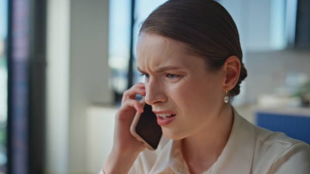 istock Irritated lady arguing smartphone discussing work trouble in office closeup. 2186829616