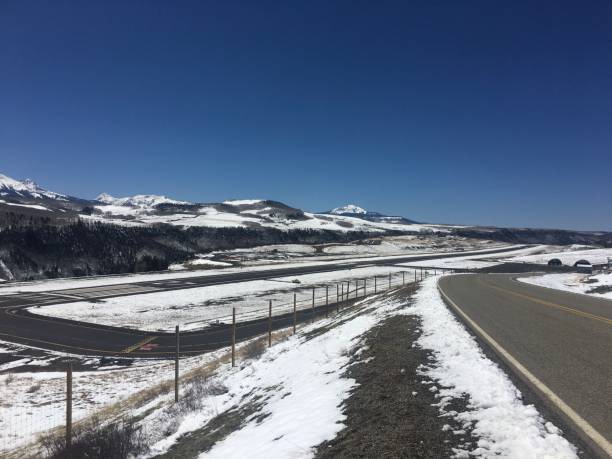 istock scenic winter mountain road 2186830611