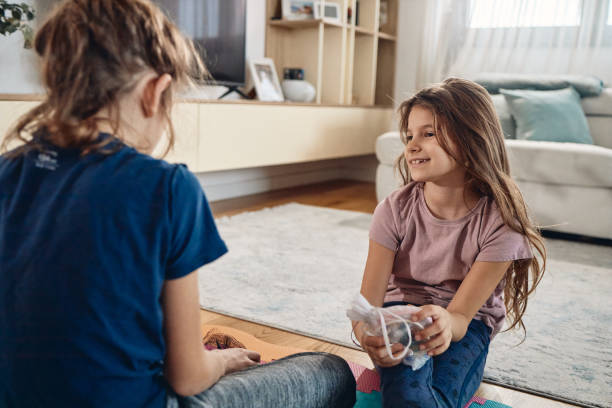 istock Playful children in living room 2186831788