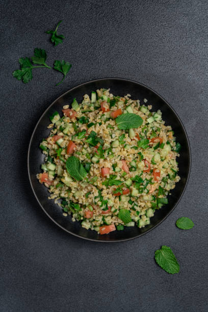istock Bulgur tabbouleh salad on a dark background 2186831839