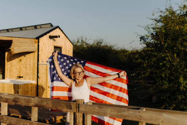 istock Authentic female Vietnam Veteran with American Flag 2186835178