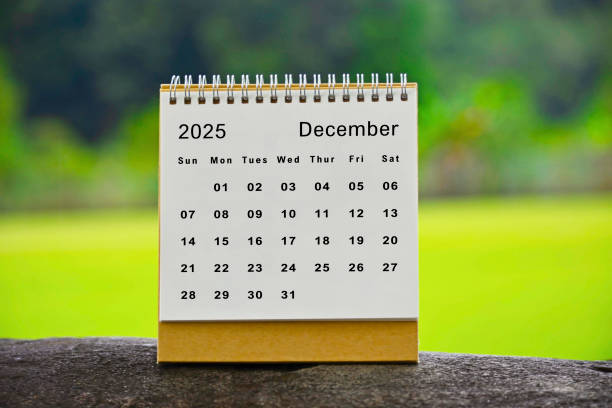 istock December 2025 white calendar with green blurred background - New year concept 2186835414