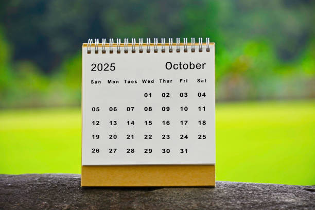 istock October 2025 white calendar with green blurred background - New year concept 2186835433