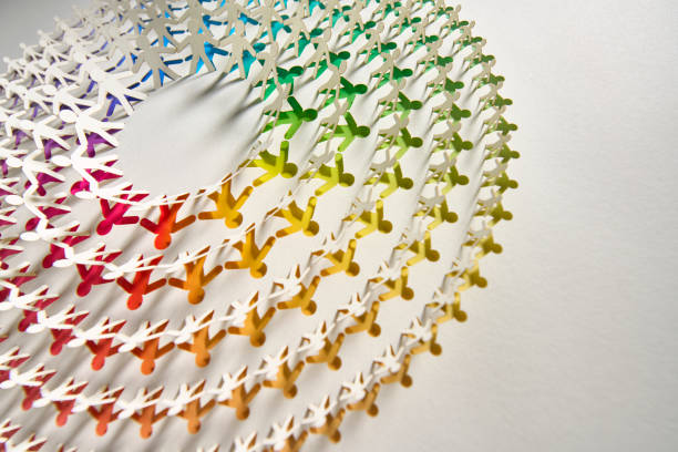 Circular paper chain design featuring interconnected human silhouettes arranged in layers. The artwork transitions through a stunning rainbow gradient, emphasizing unity and creativity. A captivating representation of precision paper craftsmanship and vibrant modern aesthetics. Native image size: 7952 x 5304.