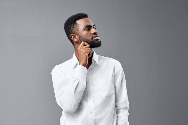 istock man space studio american standing cheerful shirt african happy young smile copy white 2186839053