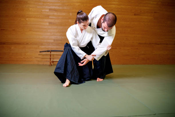 istock Training: Martial Arts Demonstration in Traditional Uniforms 2186839744