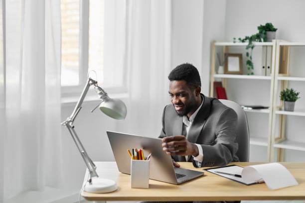istock man student laptop online computer job internet education office freelancer african american 2186839910