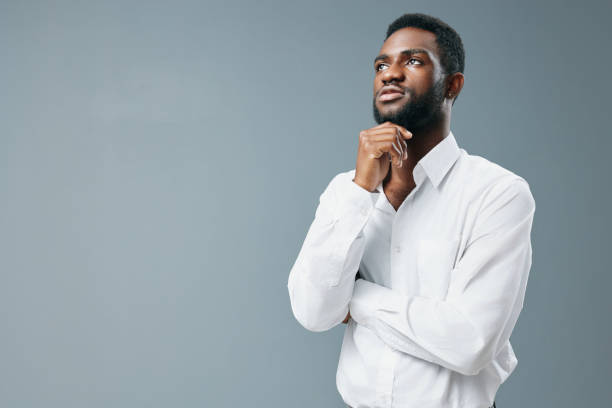 istock young man studio african afro shirt space standing copy smile american white happy 2186840045