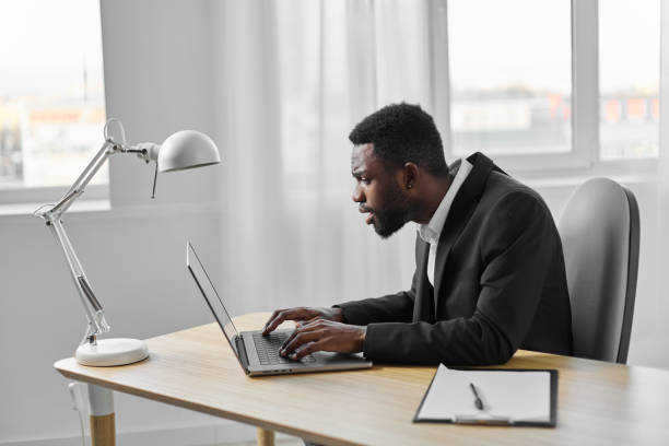 istock education man office job online freelancer laptop manager student african computer american 2186840094