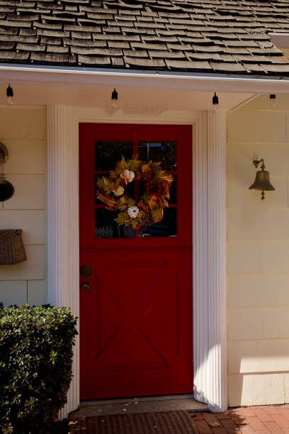 istock Beach cottage with autumn leaf wreath 2186840779