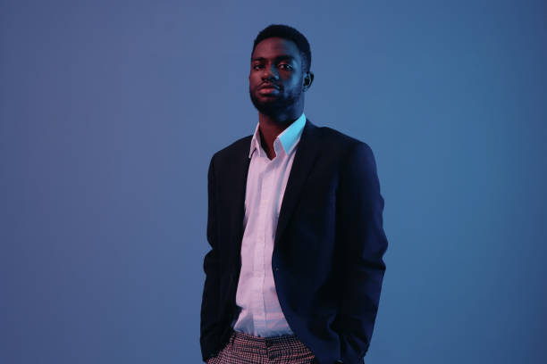 istock man studio light expression color neon model portrait art emotion businessman 2186842065