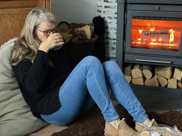 istock Retiree Woman Relaxing on a cold Winter Day 2186842108