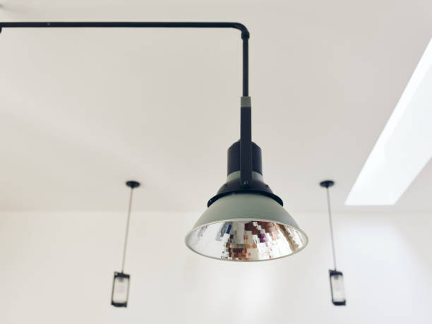 istock Stylish retro chandelier on white ceiling in a vintage interior, modern design. 2186844126
