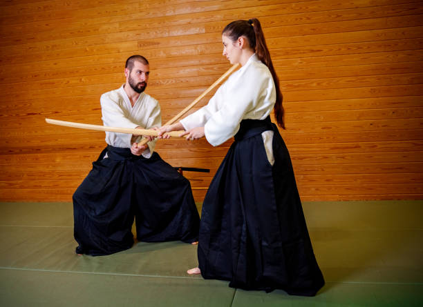 istock Martial Arts Practice with Wooden Bokken in a Dojo 2186844456
