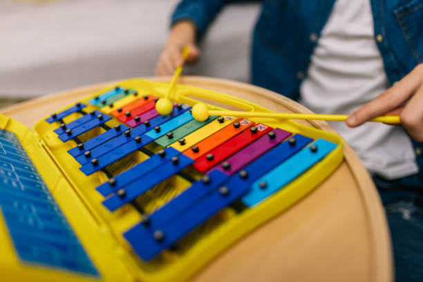 istock Boy plays metallophone at home. 2186847014