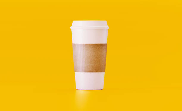 Insulated white coffee cup on yellow background. Horizontal composition.