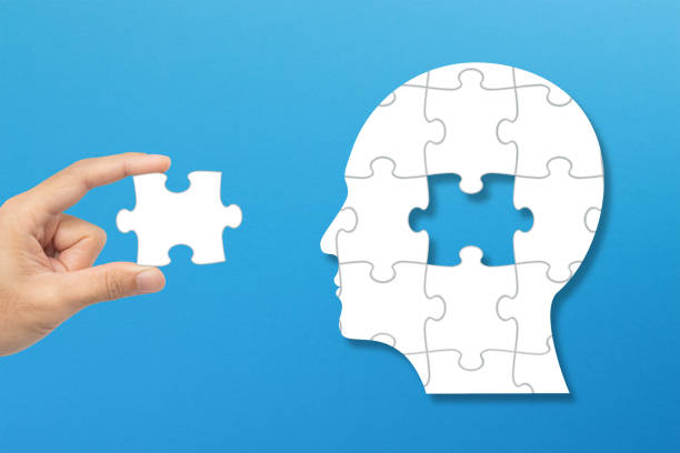 istock Connecting last missing piece of the brain puzzle. Mental health and problems with memory. 2186850177
