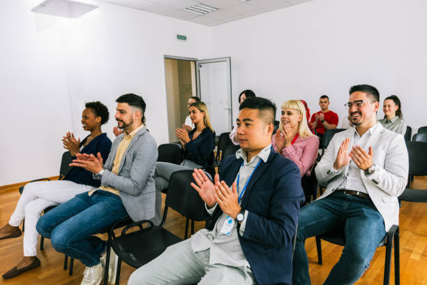 istock Multiracial group of entrepreneurs attending a seminar in multimedia classroom with smart board. They applaud. 2186850681