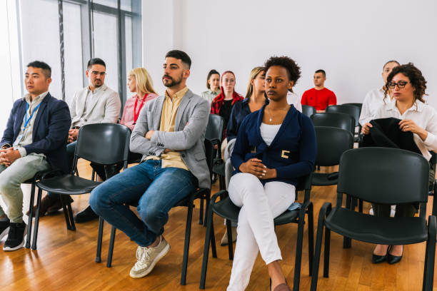 istock Multiracial group of entrepreneurs attending a seminar in multimedia classroom with smart board. 2186851679