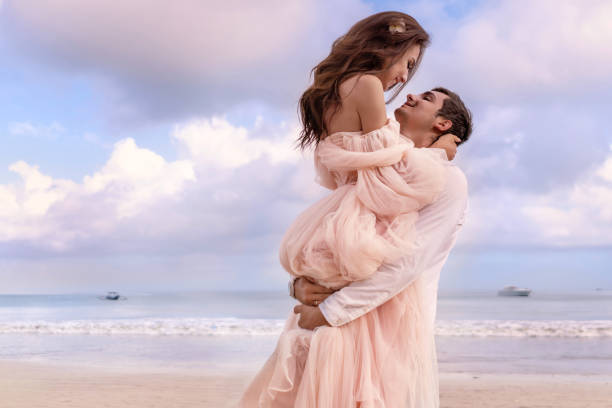 Groom holding bride, wedding carry