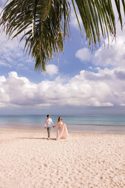 istock Caucasian wedding couple on tropical beach 2186853778