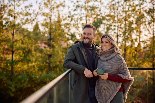 istock Happy couple enjoying in autumn view from their balcony. 2186856005
