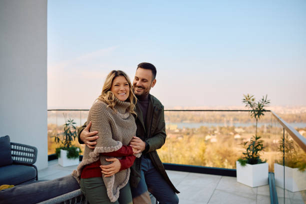 istock Happy couple enjoying on a terrace during autumn day. 2186856049