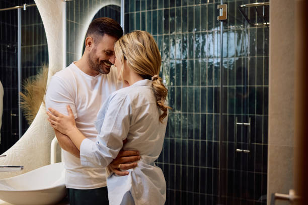 istock Affectionate couple embracing in the bathroom. 2186856199