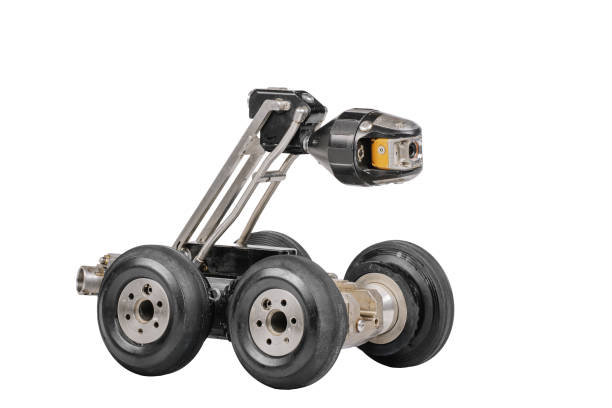 A side view of a wheeled inspection robot with a mounted camera, designed for industrial diagnostics, isolated on a white background.