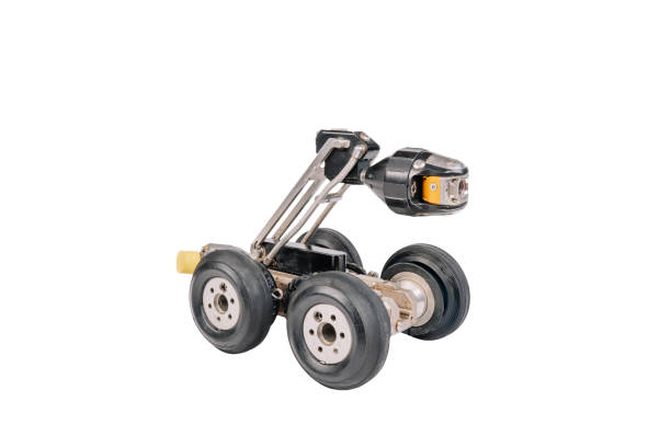 istock A robotic inspection device with four wheels and a mounted camera, designed for industrial or pipeline inspections. Isolated on white background. 2186859503