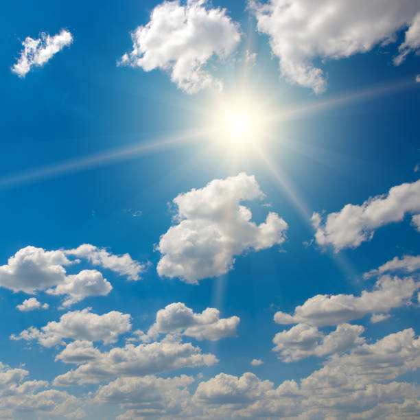 istock Bright sun on beautiful blue sky with white clouds. 2186861274
