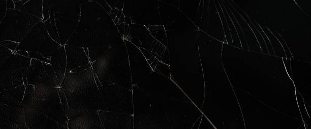 istock The pattern on the glass is cracked.  damage to the glass.  cracked texture 2186861420