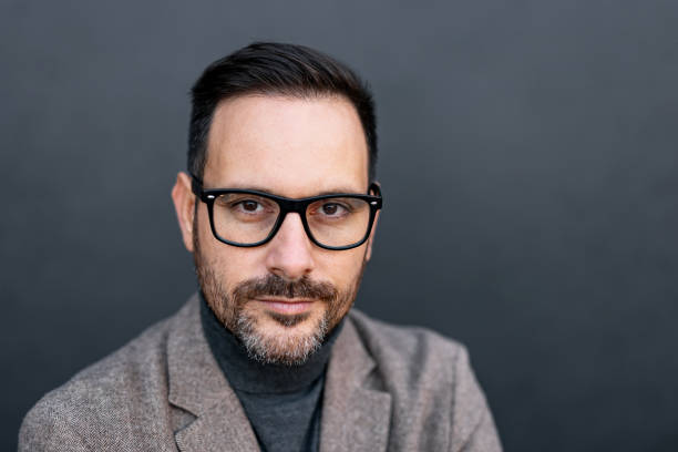istock Serious expression on man in glasses against neutral backdrop. 2186864118