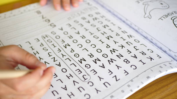 istock Close up of a kid solving a word search puzzle 2186865040