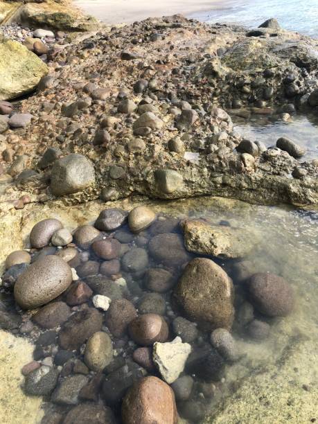 istock beach with rocks, clear ocean water 2186869286