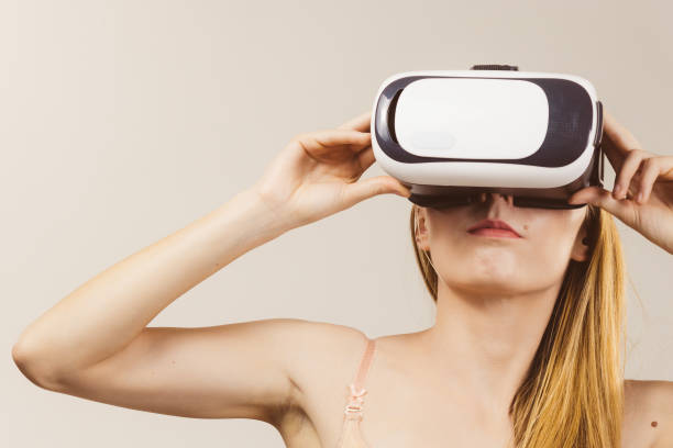 istock Girl wearing virtual reality goggles. 2186871196