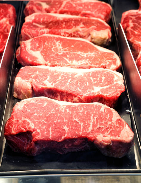 istock Ribeye steaks in a modern butcher shop 2186871649