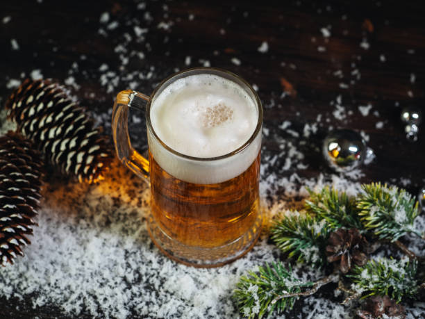istock Christmas beer mug on a snowy wooden table 2186872267