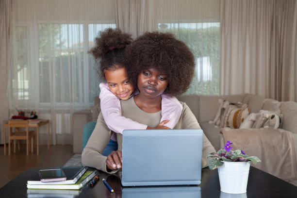 istock Mother working at home with her daughter 2186872447